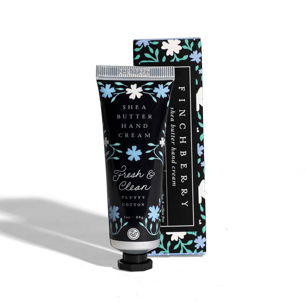 Shea butter hand cream with floral design packaging on a white background