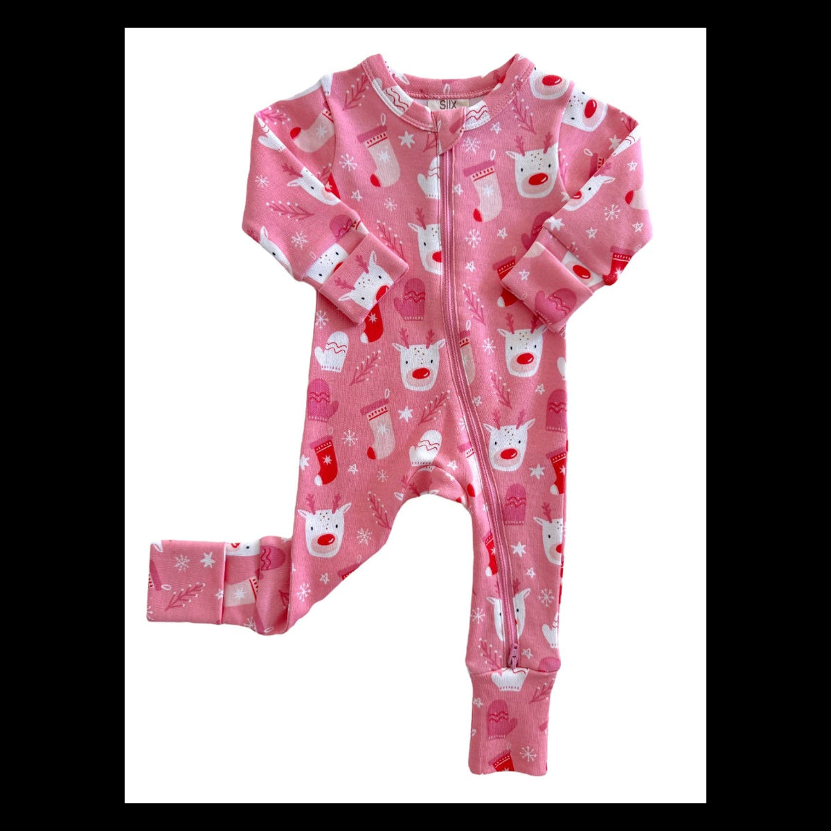 A pink baby footed sleeper with a front zipper, featuring a festive Christmas print of white pigs, red stockings, and snowflakes on a white background.