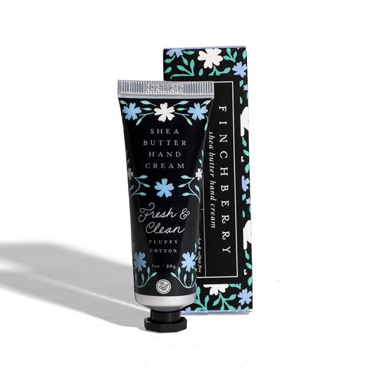 Shea butter hand cream with floral design packaging on a white background