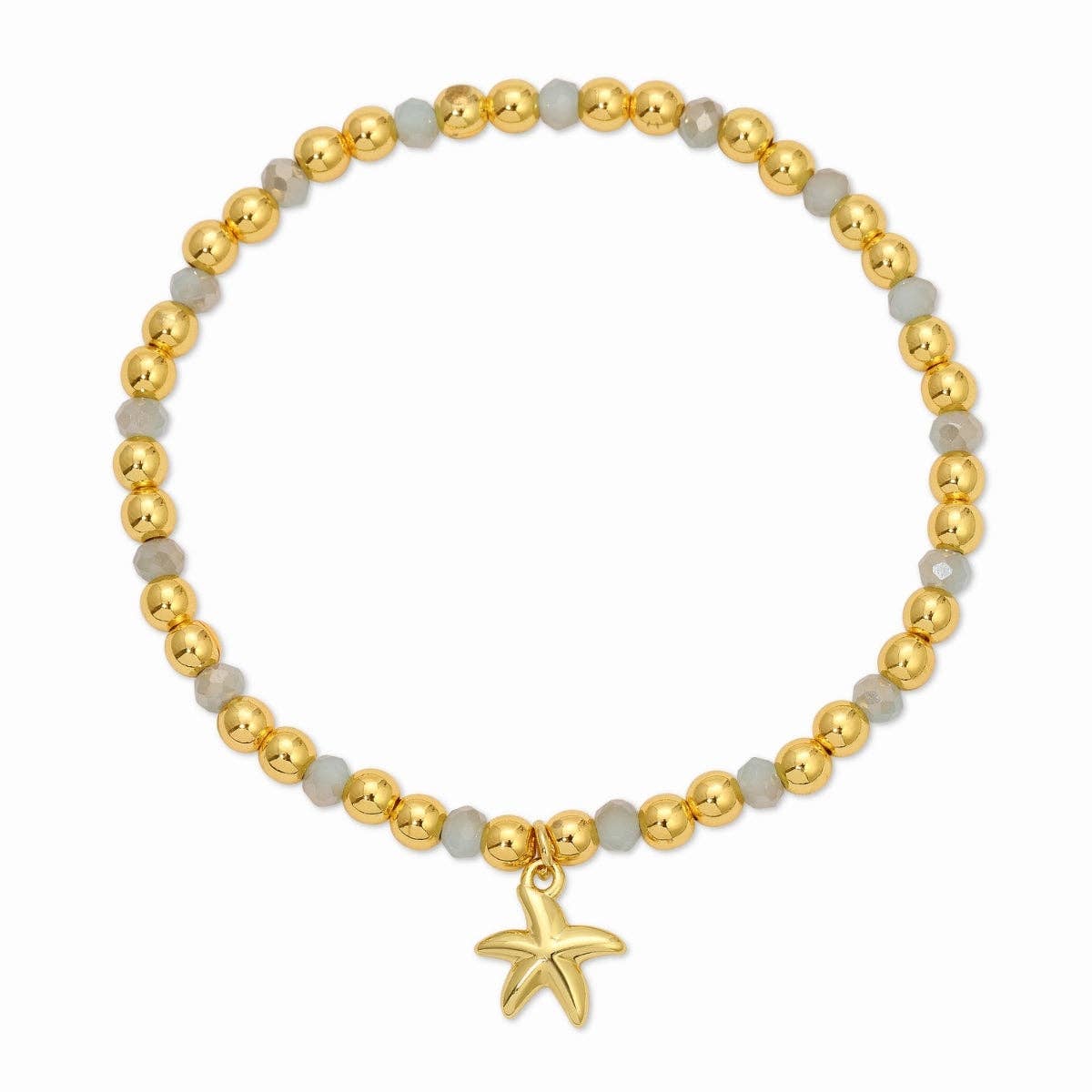 Bracelet with gold beads and a starfish charm on a white background