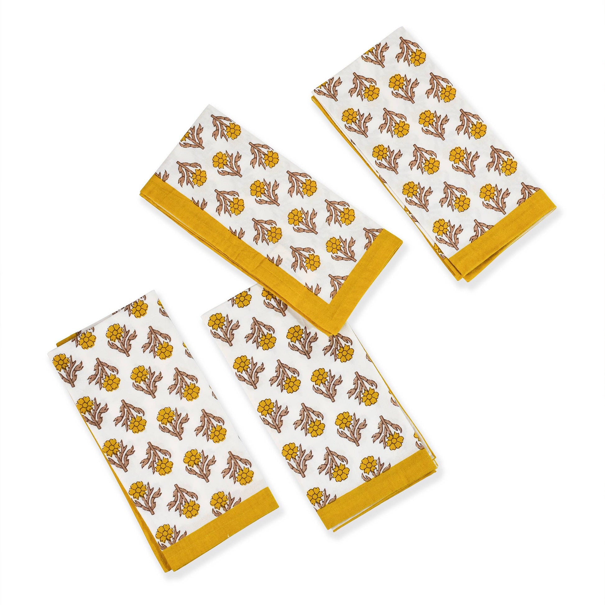 Set of three patterned towels with yellow borders on a white background