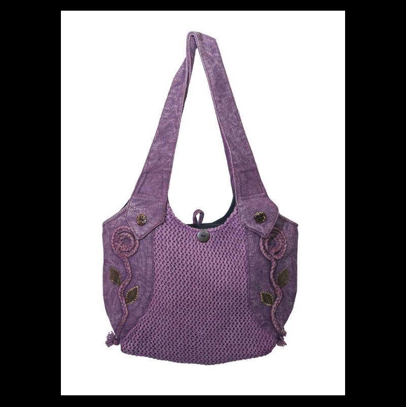 A purple woven shoulder bag with a textured body, decorative embroidered swirls and leaf motifs on the sides, and a single shoulder strap, shown against a plain white background.