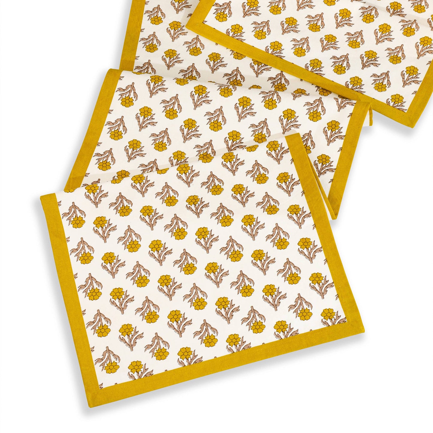 Set of three placemats with floral pattern on a white background