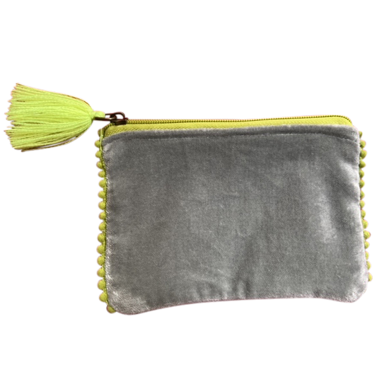 Gray velvet pouch with yellow tassel on a white background