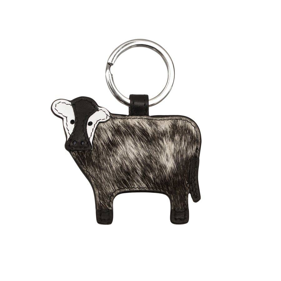 Keychain shaped like a cow on a white background
