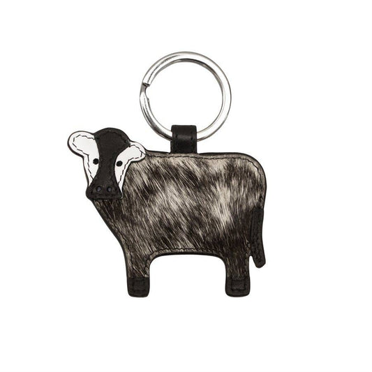 Keychain shaped like a cow on a white background