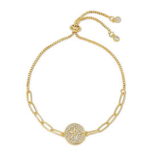 Gold bracelet with a decorative clasp on a white background