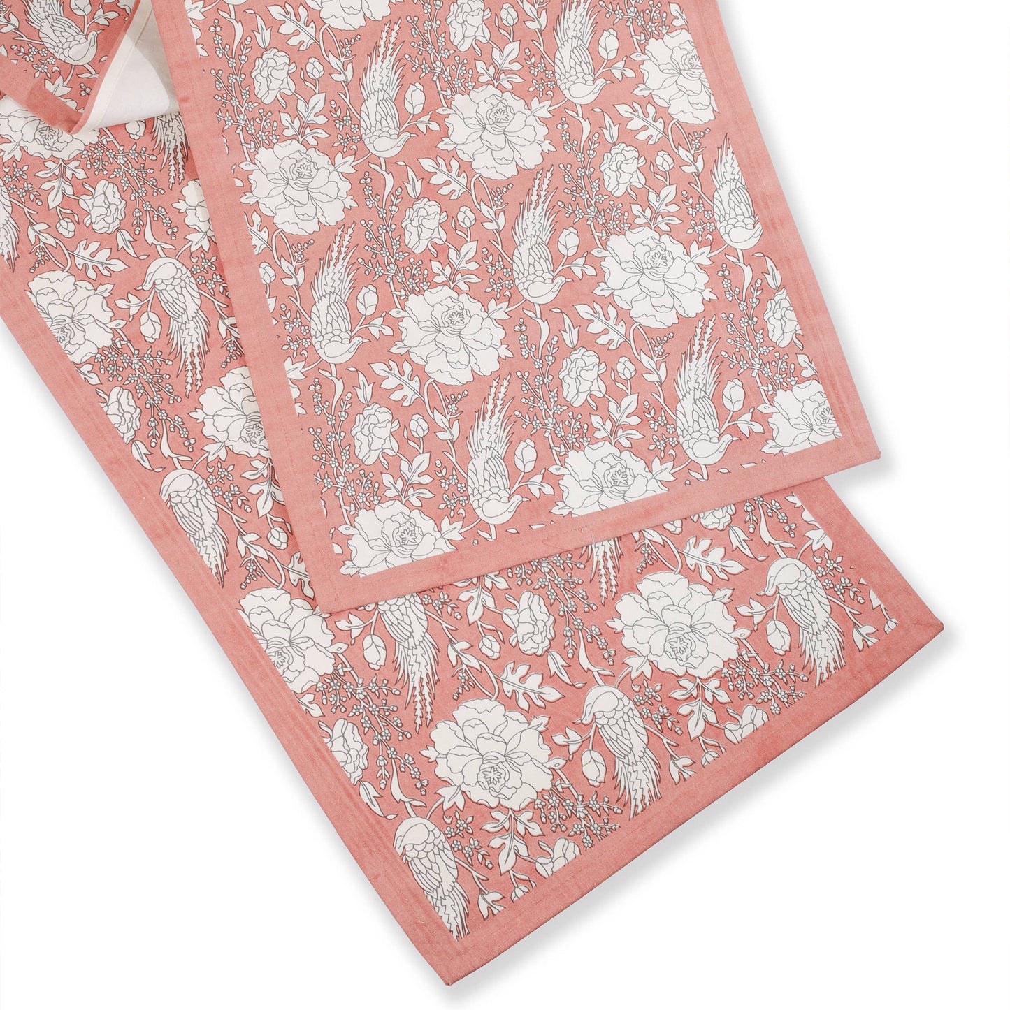 Set of pink floral towels on a white background
