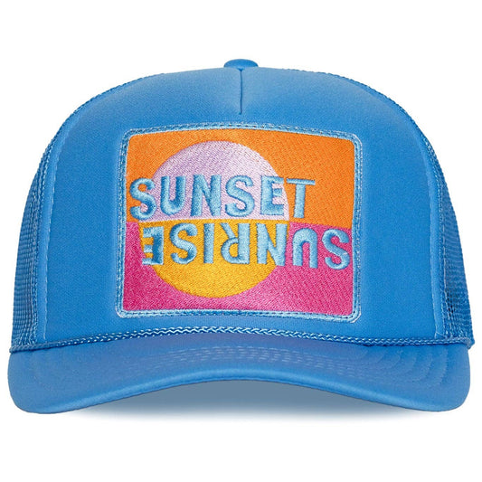 Blue trucker hat with a colorful 'Sunset Sunrise' patch on a white background