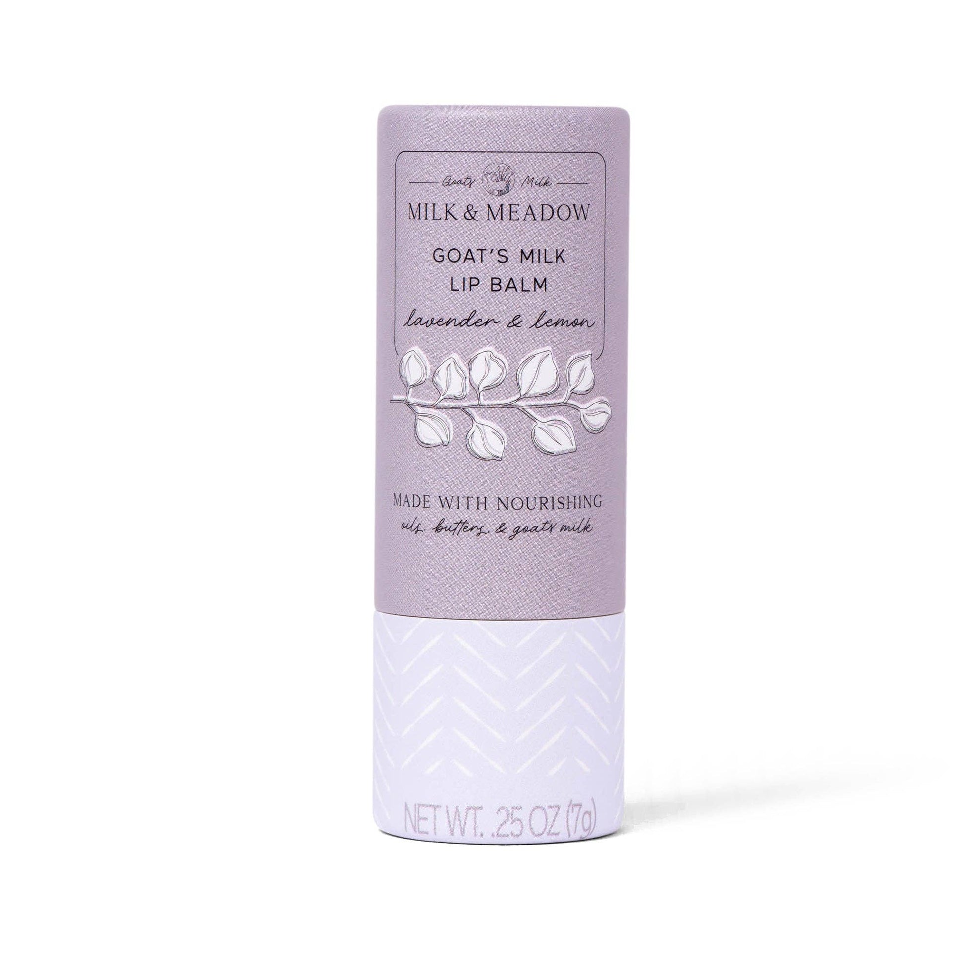 Milk & Meadow Goat's Milk Lip Balm in a lavender and white tube, featuring a botanical leaf illustration on a clean white background.