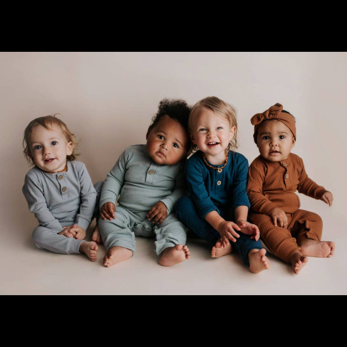 babies with playsuits on