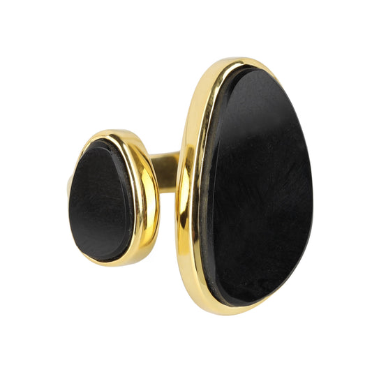 A pair of gold cufflinks with large, irregularly shaped black stone inlays, shown on a plain white background.
