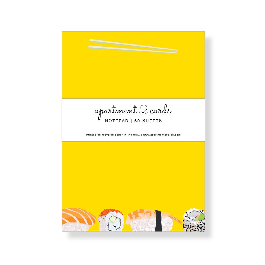 sushi and chop sticks on yellow paper