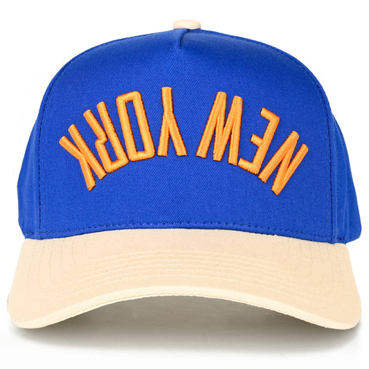 Blue and beige cap with 'New York' text on a white background