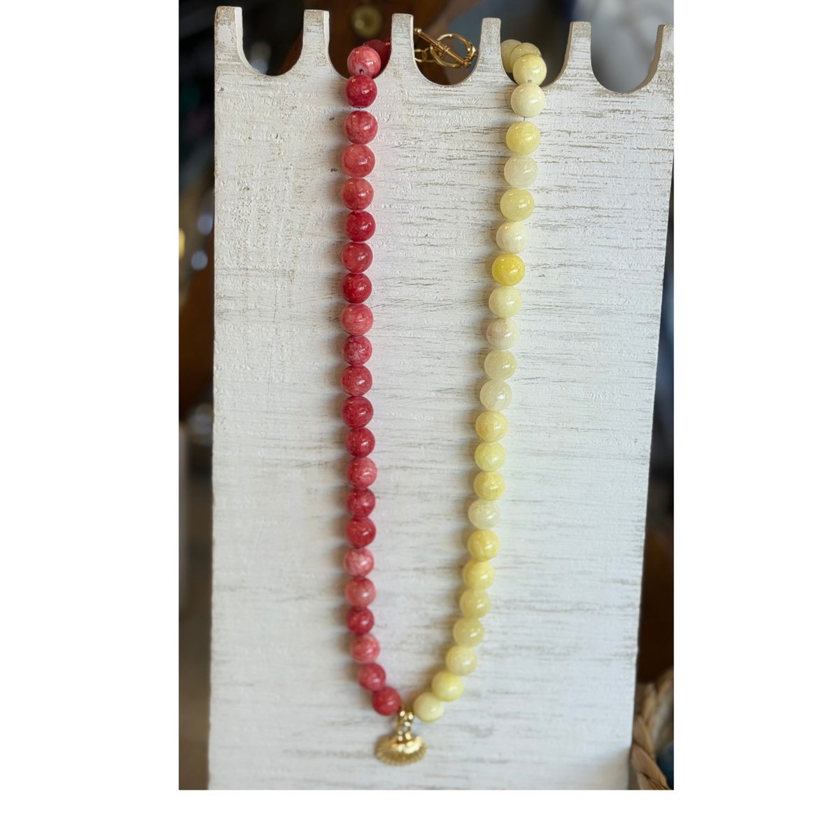 Love and Clay Necklace. Pink and Yellow beads with Shell pendant. Gold Clasp at back.